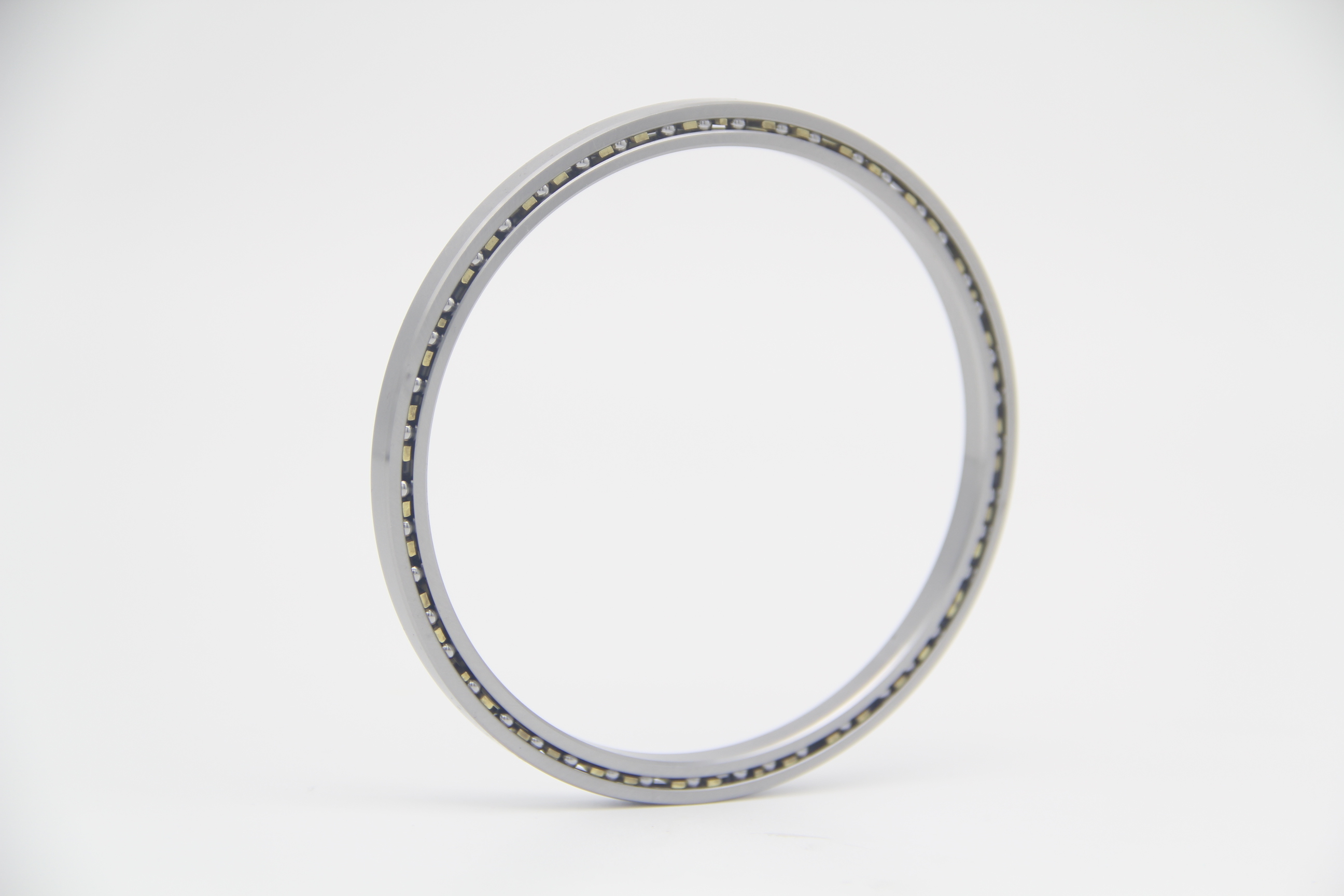 Open thin section bearing with exposed balls and separator